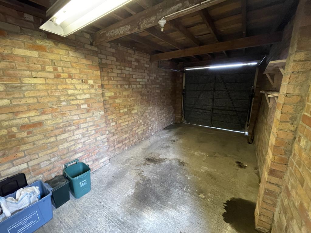 Lot: 99 - LINK-DETACHED HOUSE IN NEED OF COMPLETE RENOVATION AND REPAIR - Image of garage inside for St Albans house for auction